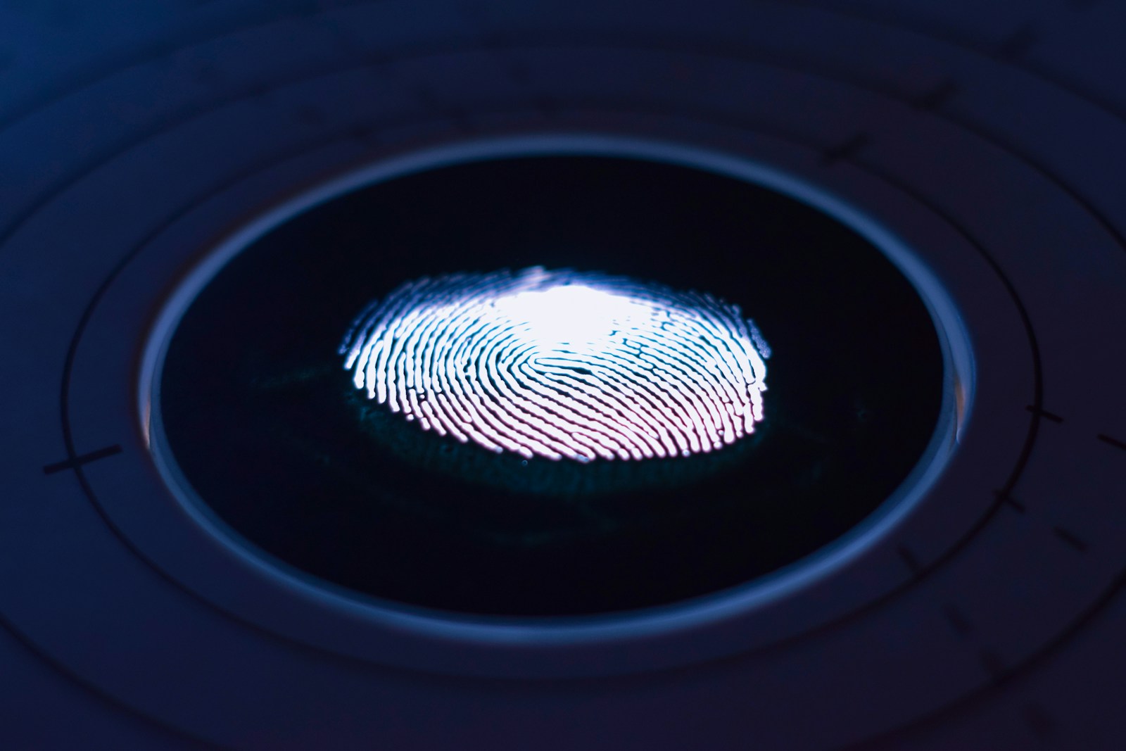 Employee placing a finger on a biometric attendance terminal: Biometric Attendance System in Kalyan-Dombivli